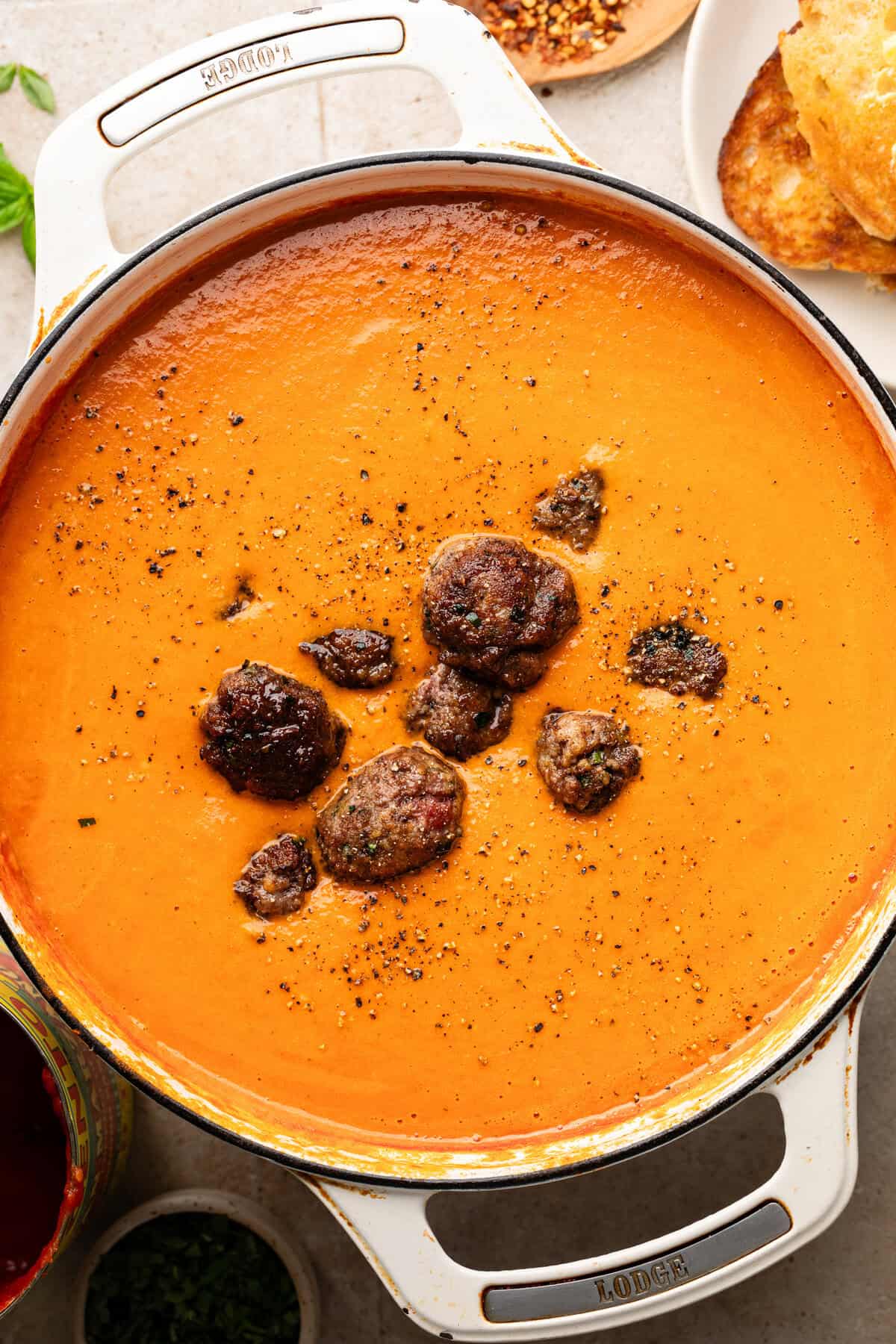 Adding meatballs to soup.
