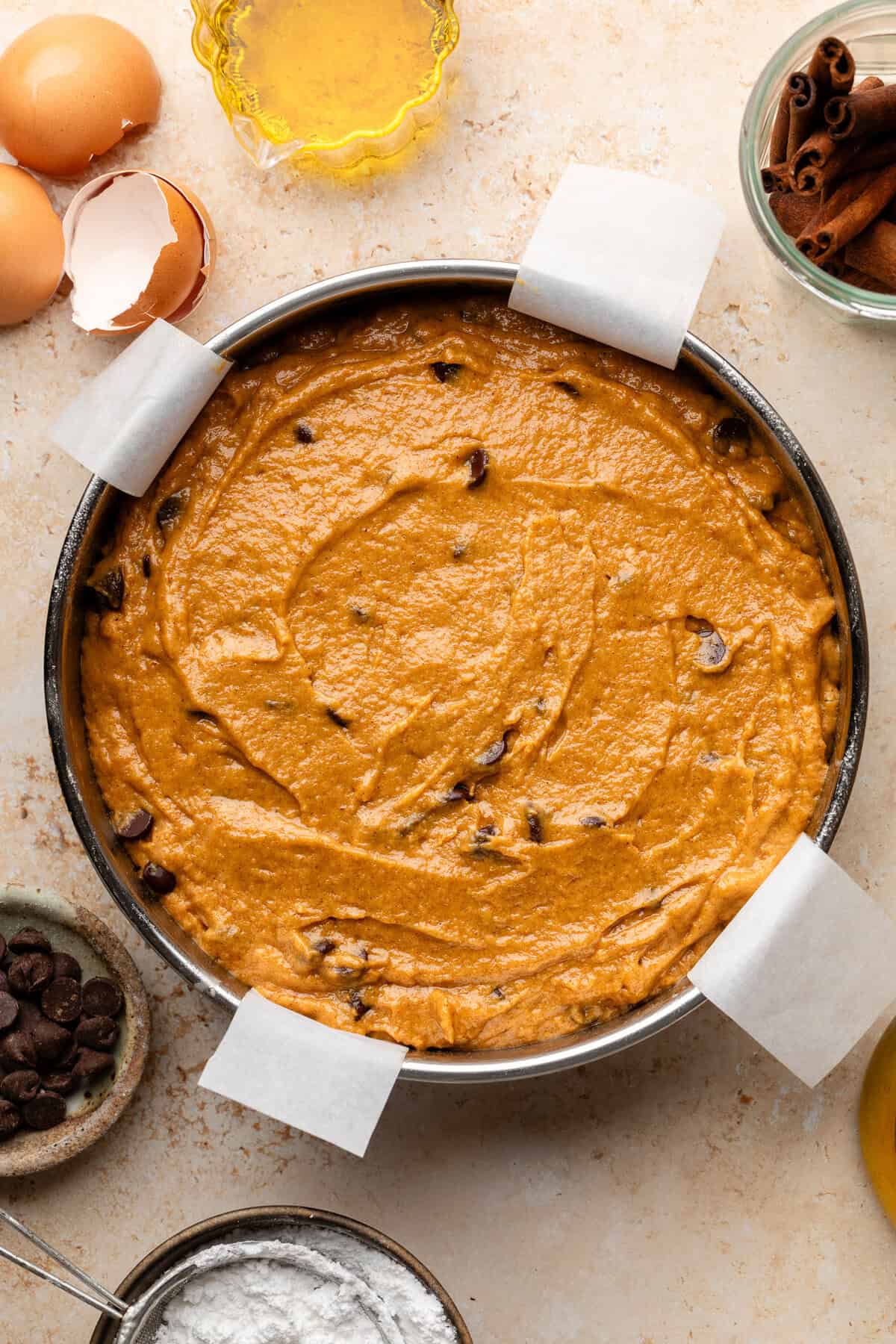 pumpkin olive oil cake batter in round cake pan