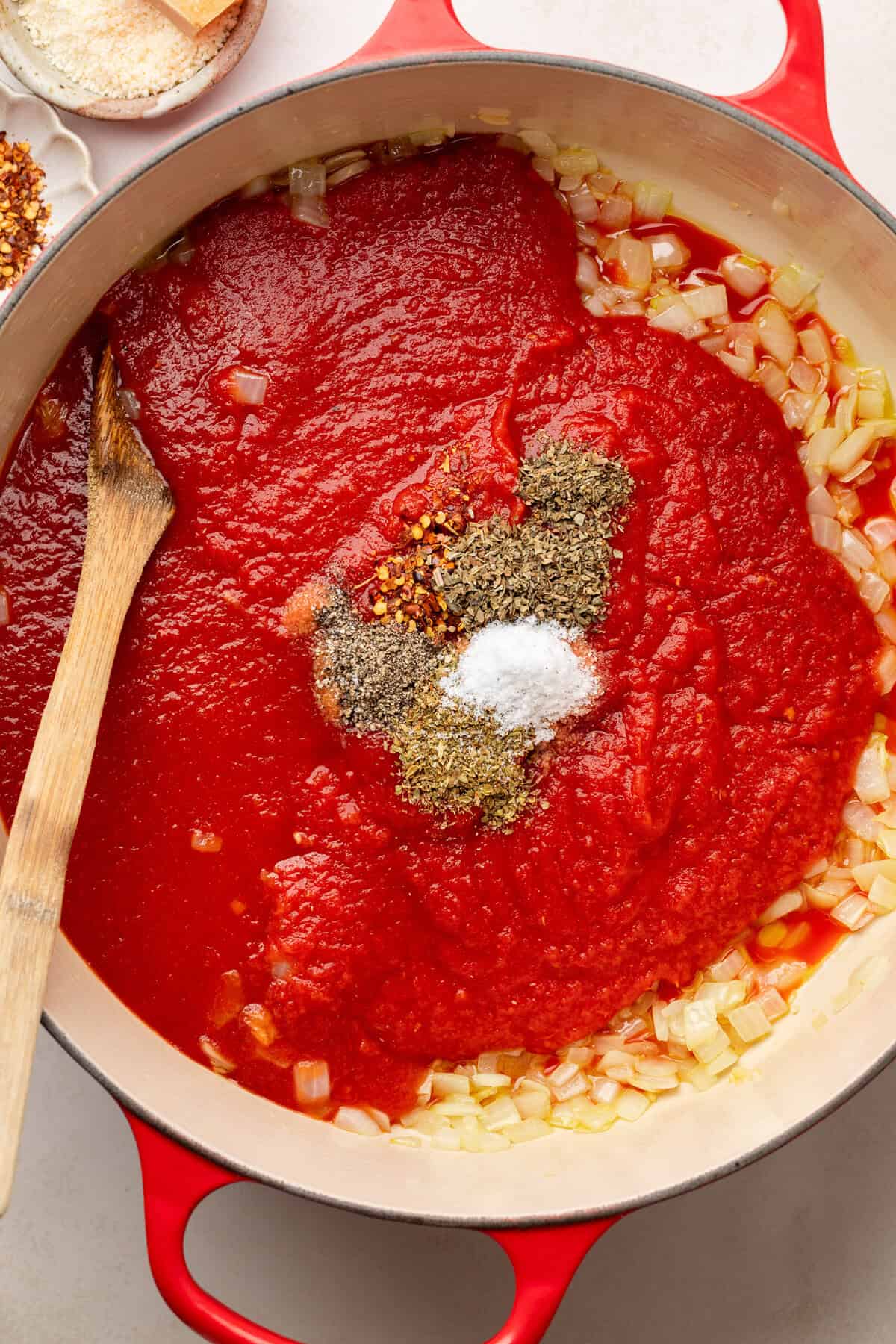 ingredients for chicken parmesan soup in a sauce pan