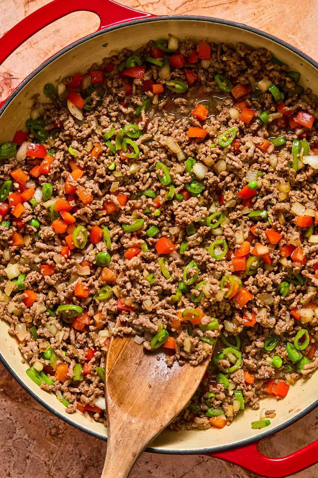 cooked ground beef in pan with veggies